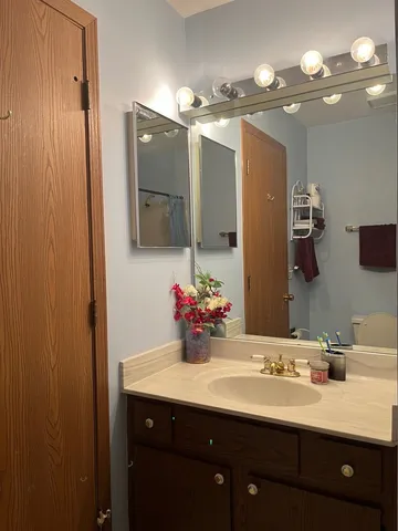 a bathroom with a sink double vanity and a mirror