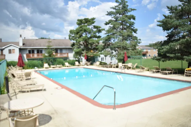 a view of a swimming pool with a lounge chairs