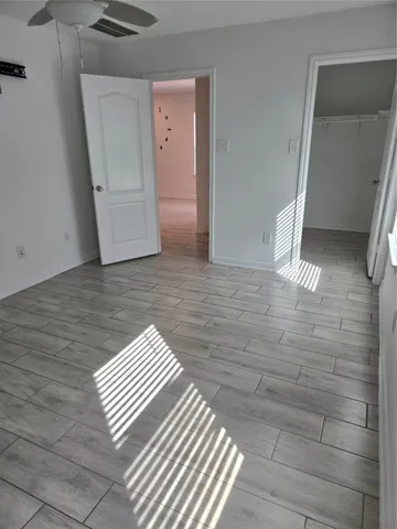a view of a bathroom from a hallway