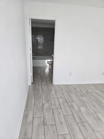 a bathroom with a sink a toilet and bathtub