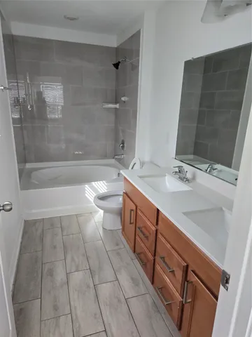 a view of backyard with wooden fence