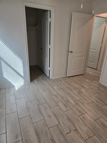 a view of a livingroom with an empty space and a fireplace