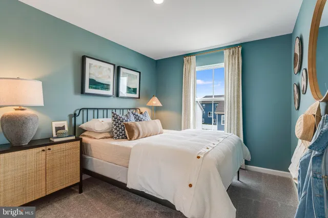 a bedroom with a bed and dresser