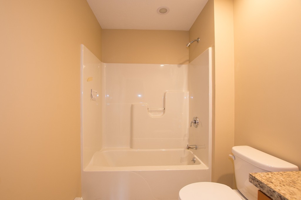 17 Arcade Street, Unit B Northbridge, MA 01588 - Photo 15 of 29 a bathroom with a bathtub and a toilet