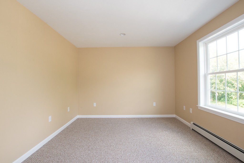 17 Arcade Street, Unit B Northbridge, MA 01588 - Photo 21 of 29 an empty room with a window