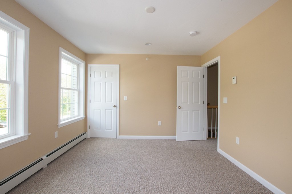 17 Arcade Street, Unit B Northbridge, MA 01588 - Photo 23 of 29 a view of empty room with windows