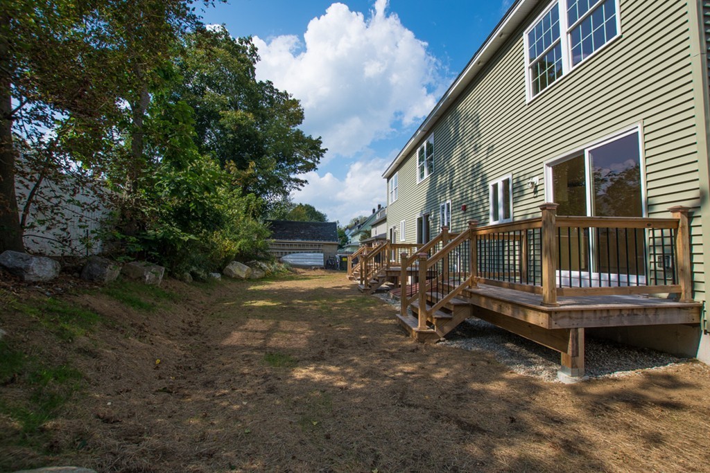 17 Arcade Street, Unit B Northbridge, MA 01588 - Photo 28 of 29 a view of a house with a yard