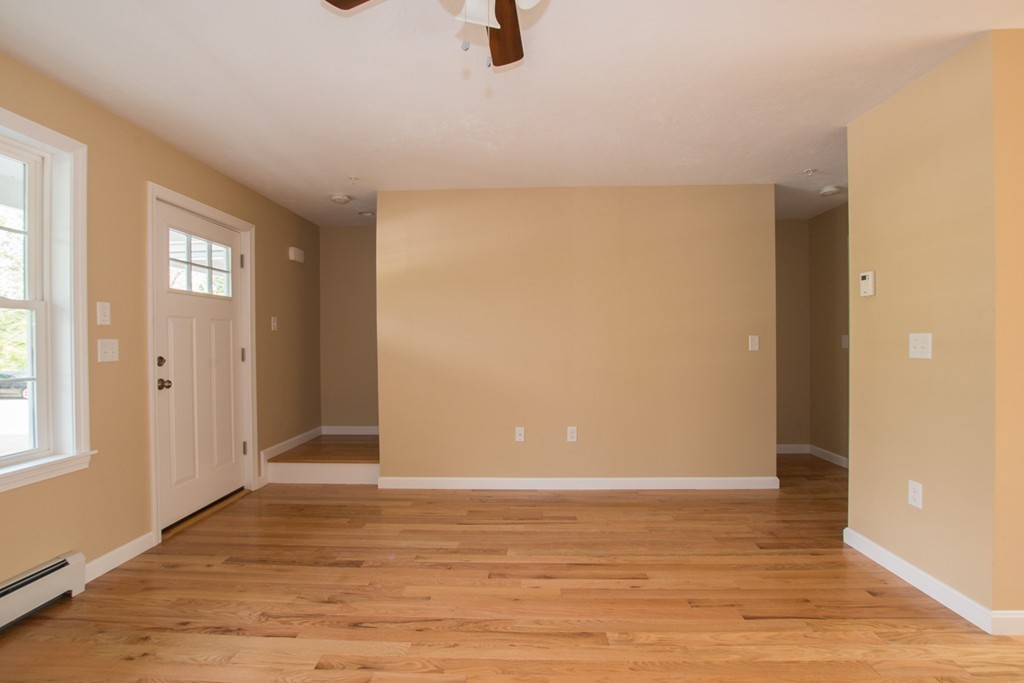 17 Arcade Street, Unit B Northbridge, MA 01588 - Photo 5 of 29 a view of an empty room with window and wooden floor