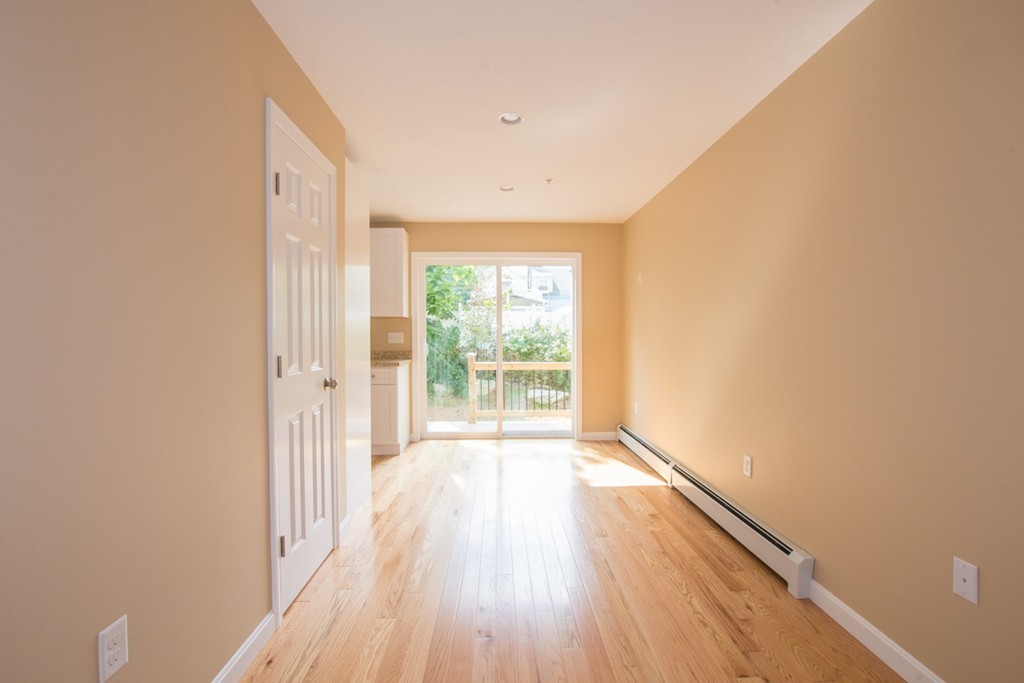 17 Arcade Street, Unit B Northbridge, MA 01588 - Photo 7 of 29 a view of a room with wooden floor and a window