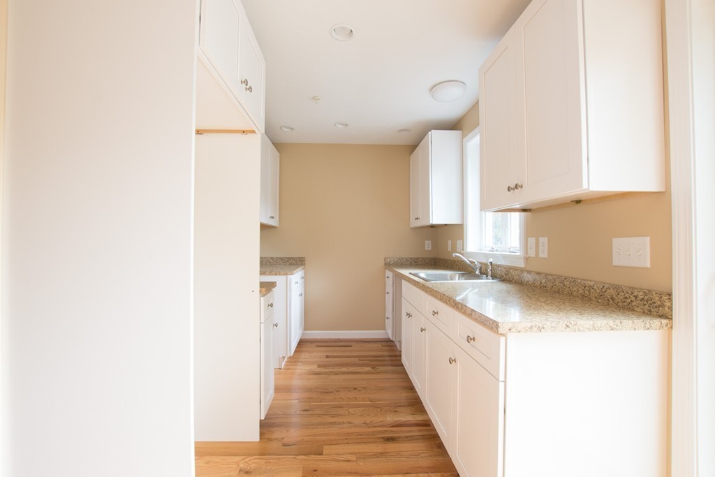 17 Arcade Street, Unit B Northbridge, MA 01588 - Photo 8 of 29 a kitchen with a sink and cabinets