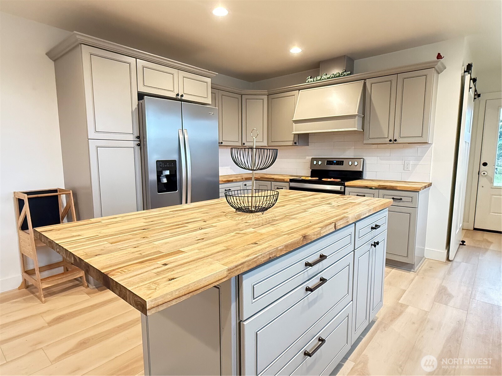 403 A Street South Bend, WA 98586 - Photo 7 of 20 a kitchen with stainless steel appliances a refrigerator sink and cabinets