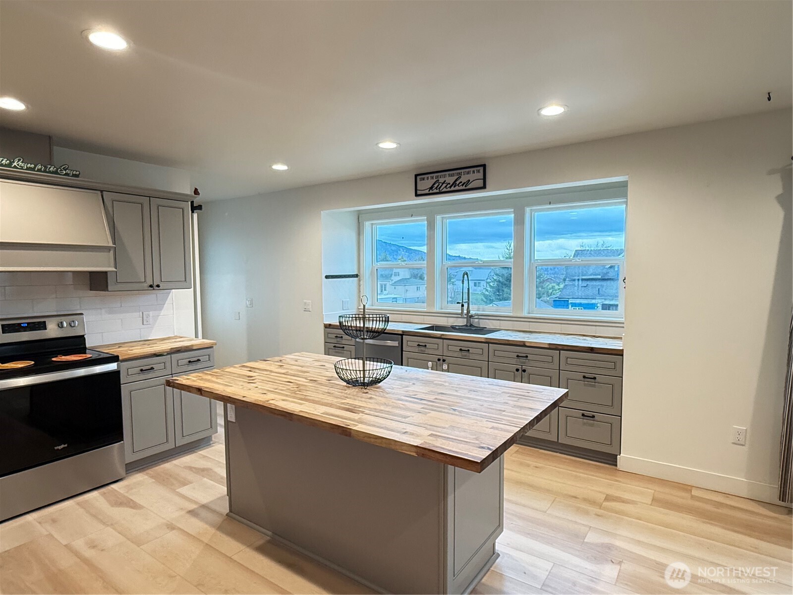403 A Street South Bend, WA 98586 - Photo 9 of 20 a kitchen with stainless steel appliances granite countertop a stove a sink and a refrigerator