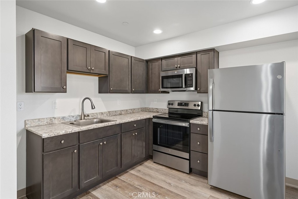 529 South Pine Street Santa Maria, CA 93458 - Photo 11 of 53 a kitchen with a sink a stove a refrigerator and cabinets