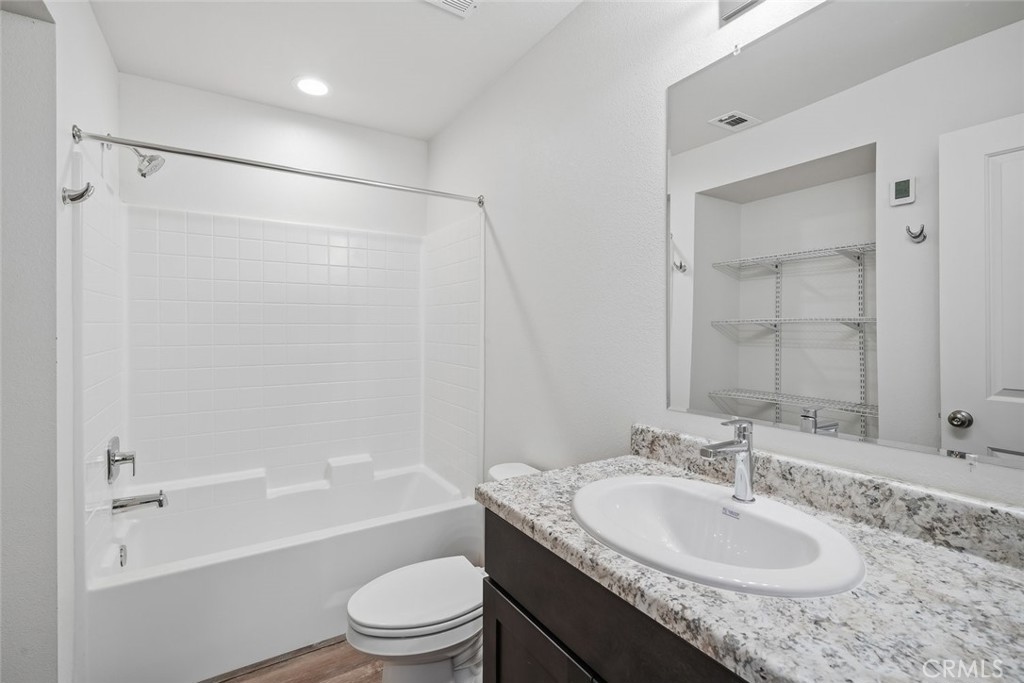 529 South Pine Street Santa Maria, CA 93458 - Photo 14 of 53 a bathroom with a granite countertop sink toilet and shower