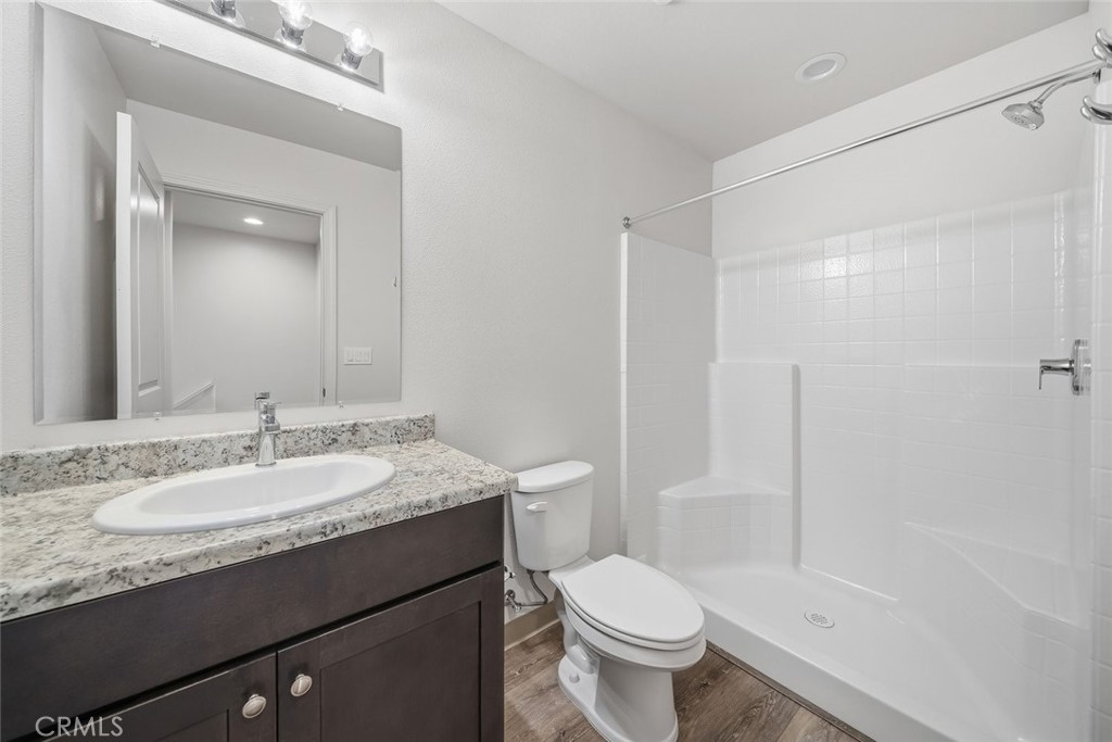 529 South Pine Street Santa Maria, CA 93458 - Photo 17 of 53 a bathroom with a granite countertop sink toilet and shower
