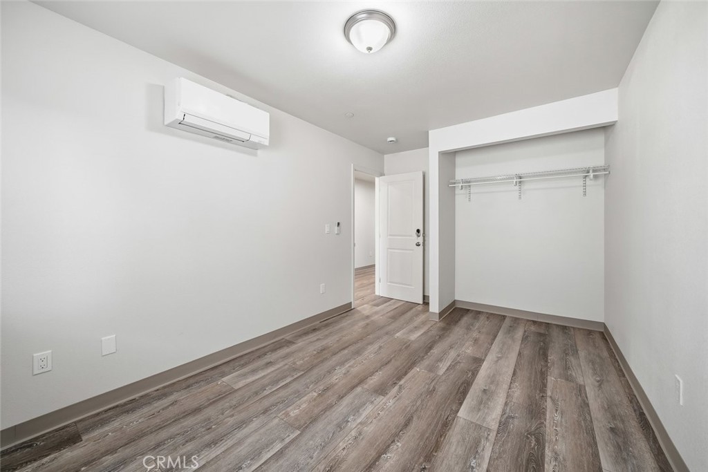 529 South Pine Street Santa Maria, CA 93458 - Photo 22 of 53 a view of an empty room with wooden floor and a window