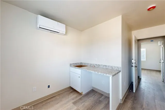 an empty room with wooden floor