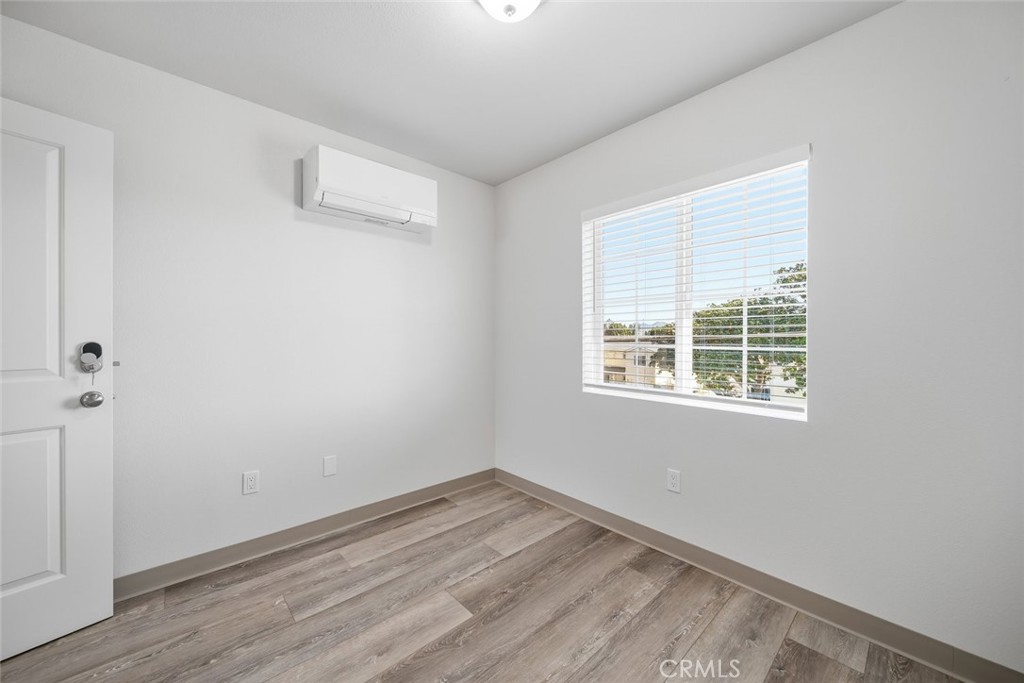 529 South Pine Street Santa Maria, CA 93458 - Photo 26 of 53 an empty room with wooden floor and windows