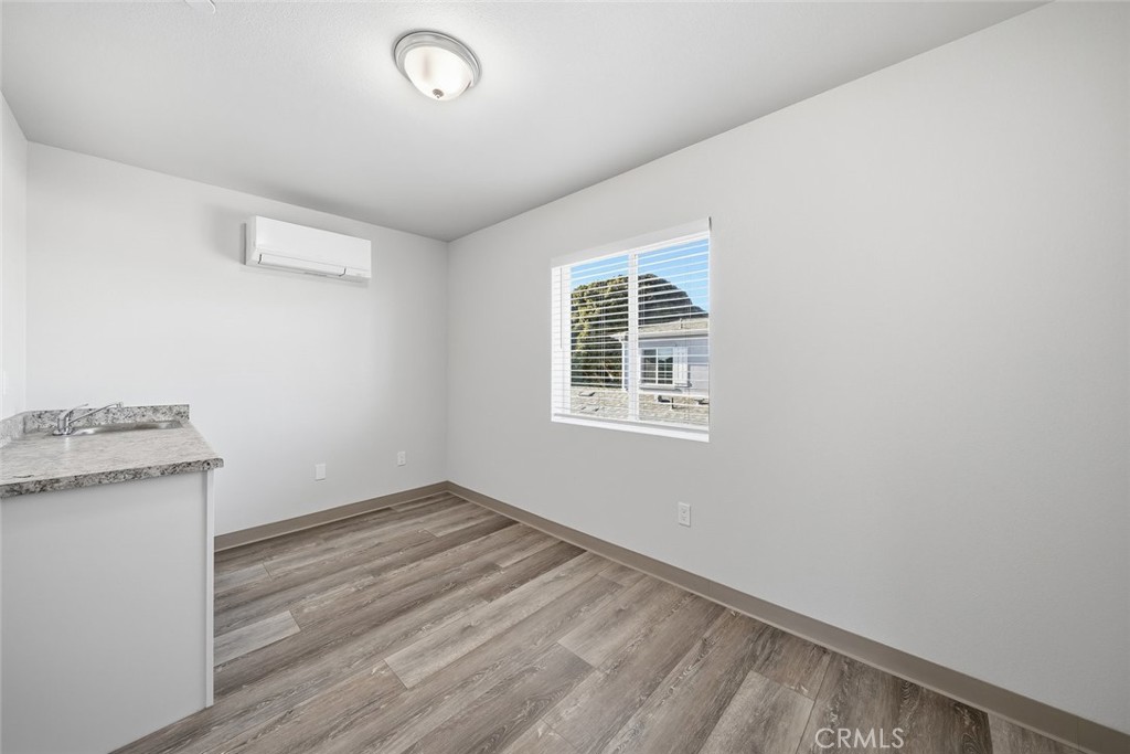 529 South Pine Street Santa Maria, CA 93458 - Photo 27 of 53 an empty room with a stove and a window
