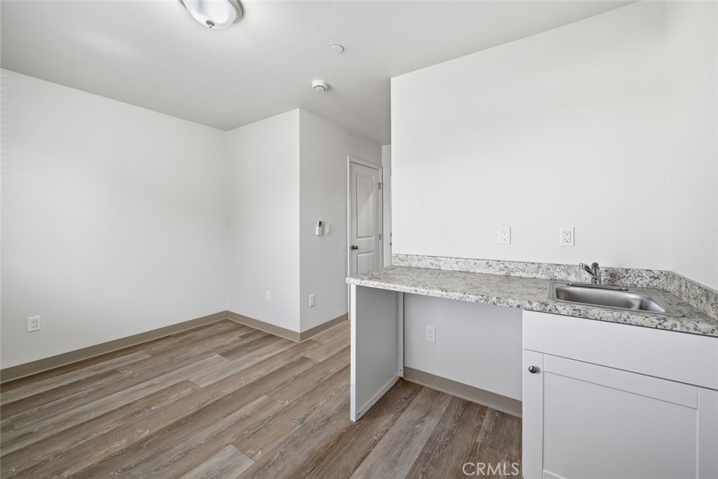 529 South Pine Street Santa Maria, CA 93458 - Photo 29 of 53 a view of a kitchen with wooden floor and cabinets