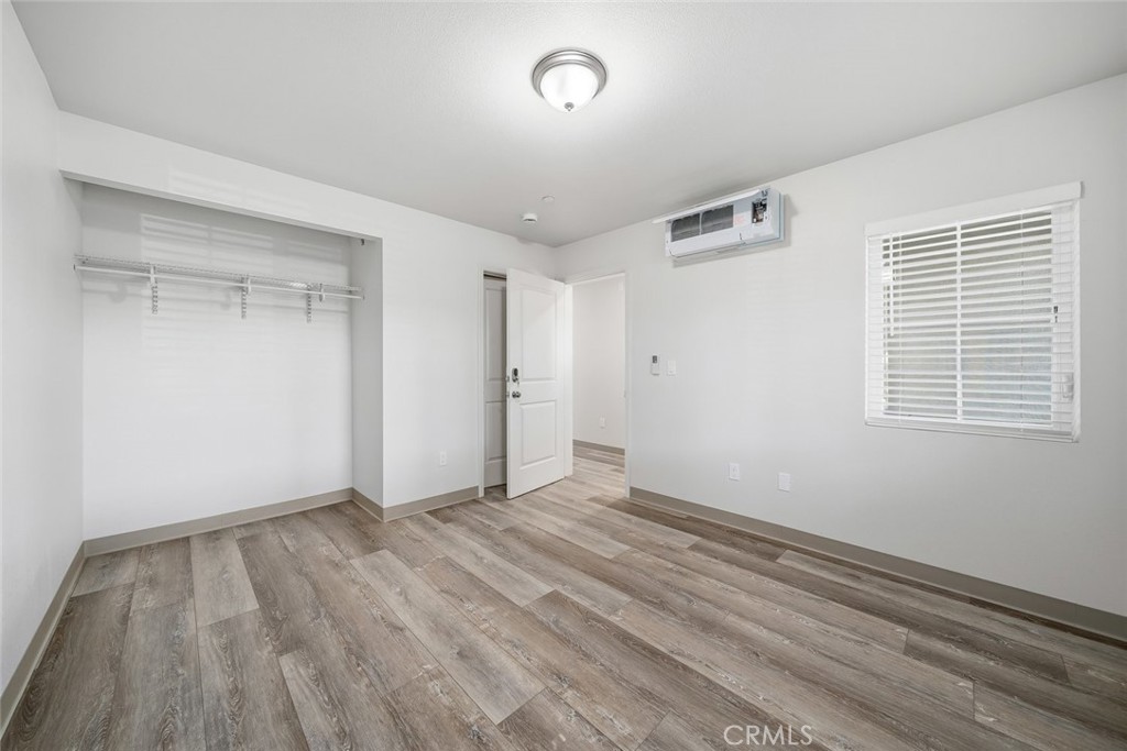 529 South Pine Street Santa Maria, CA 93458 - Photo 32 of 53 a view of an empty room with wooden floor and a window