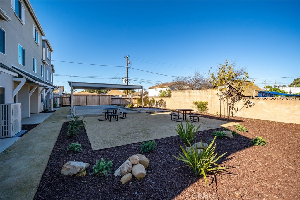 529 South Pine Street Santa Maria, CA 93458 - Photo 40 of 53 a view of a patio with table and chairs potted plants