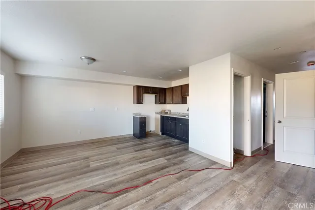 a view of a kitchen with wooden floor