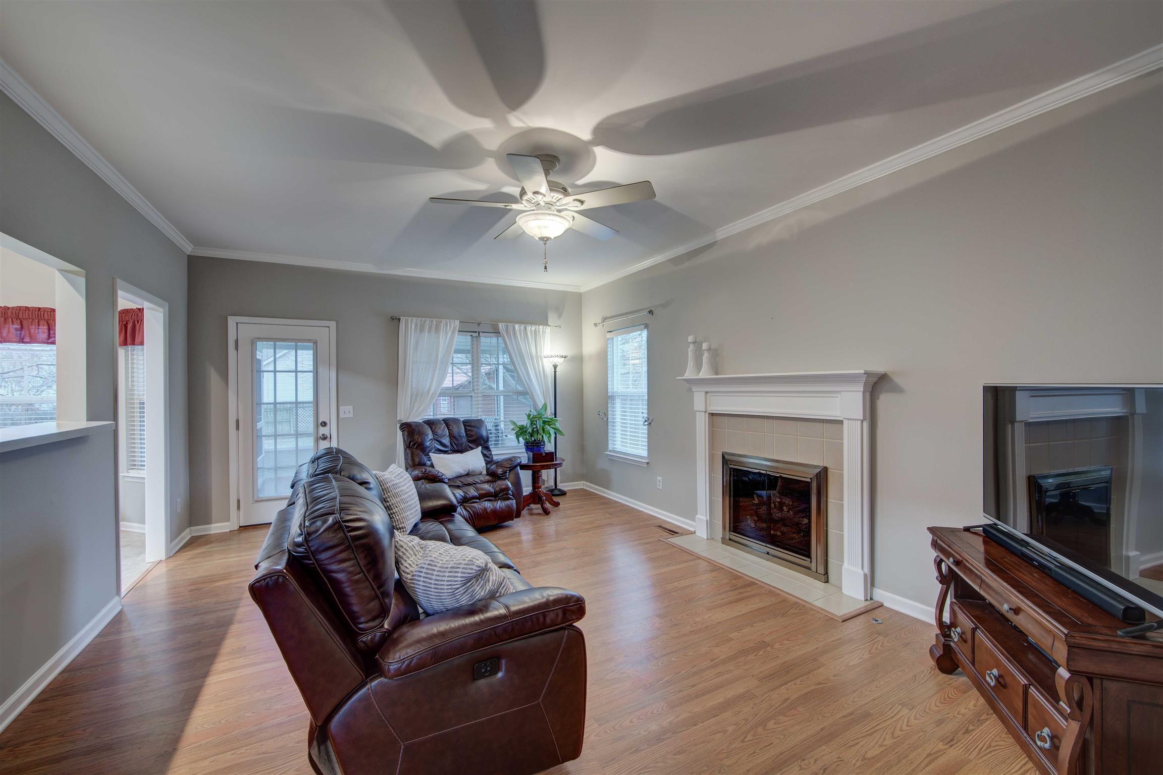 1801 O'Reilly Circle Spring Hill, TN 37174 - Photo 12 of 22 Family Room with fireplace and bar access to the kitchen is perfect for family gatherings or game night!