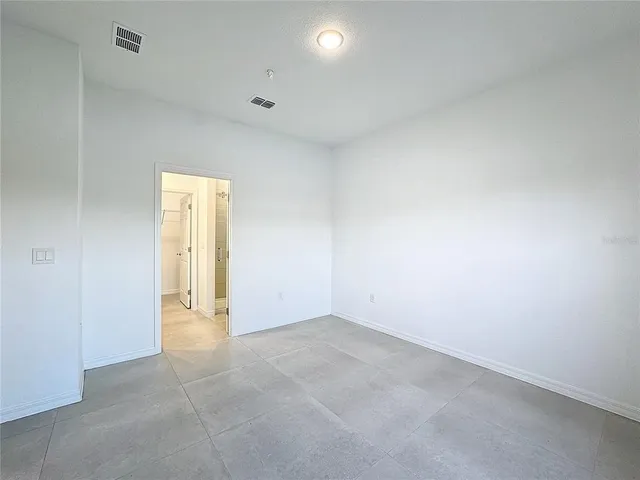 a bathroom with a shower a toilet and a sink
