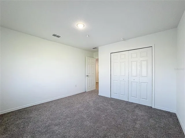 an empty room with a empty space and window