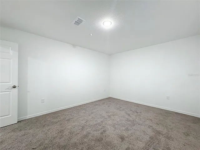 a white toilet sitting next to a bath tub