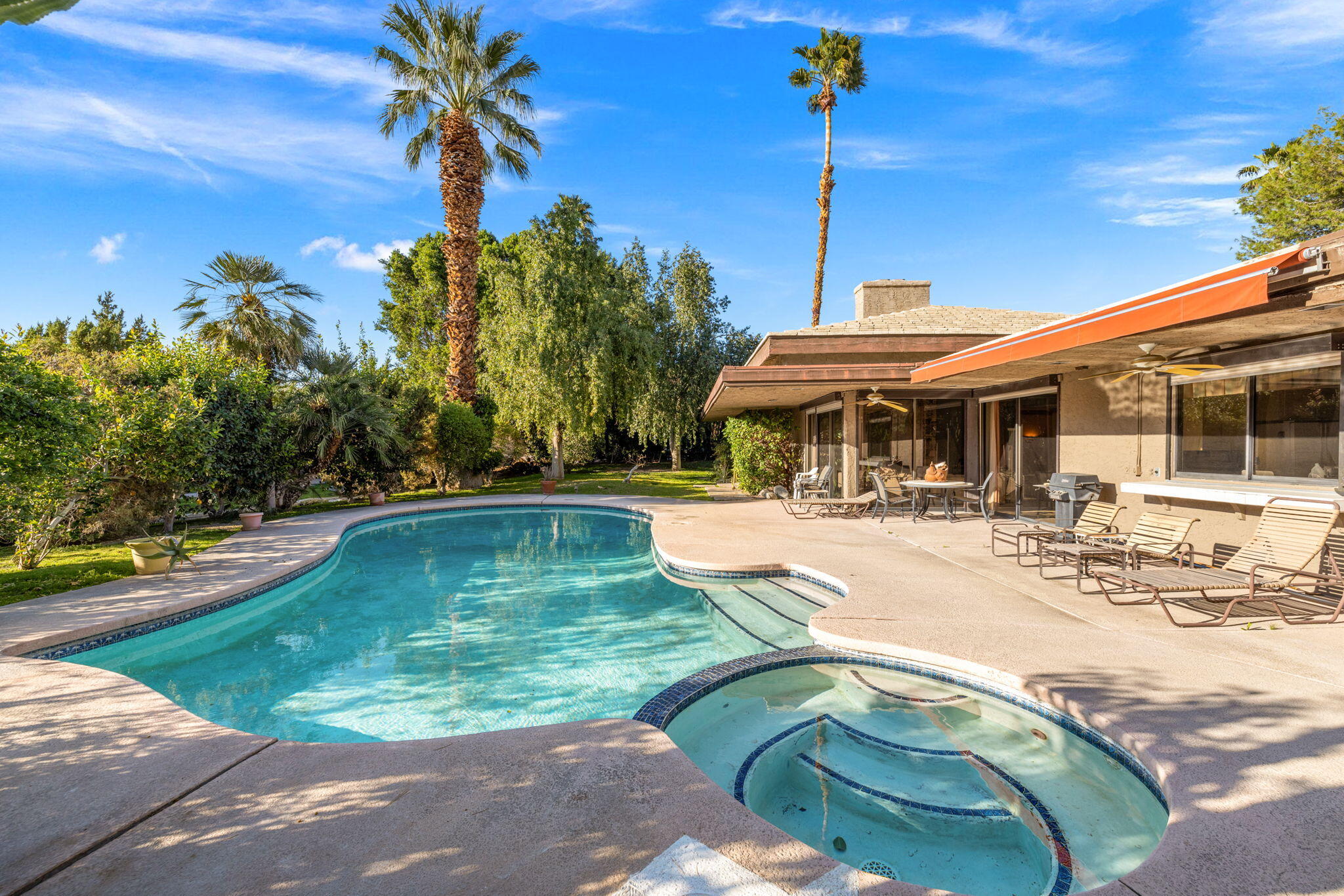 40675 East Thunderbird Terrace Rancho Mirage, CA 92270 - Photo 13 of 58 a view of a swimming pool with a patio