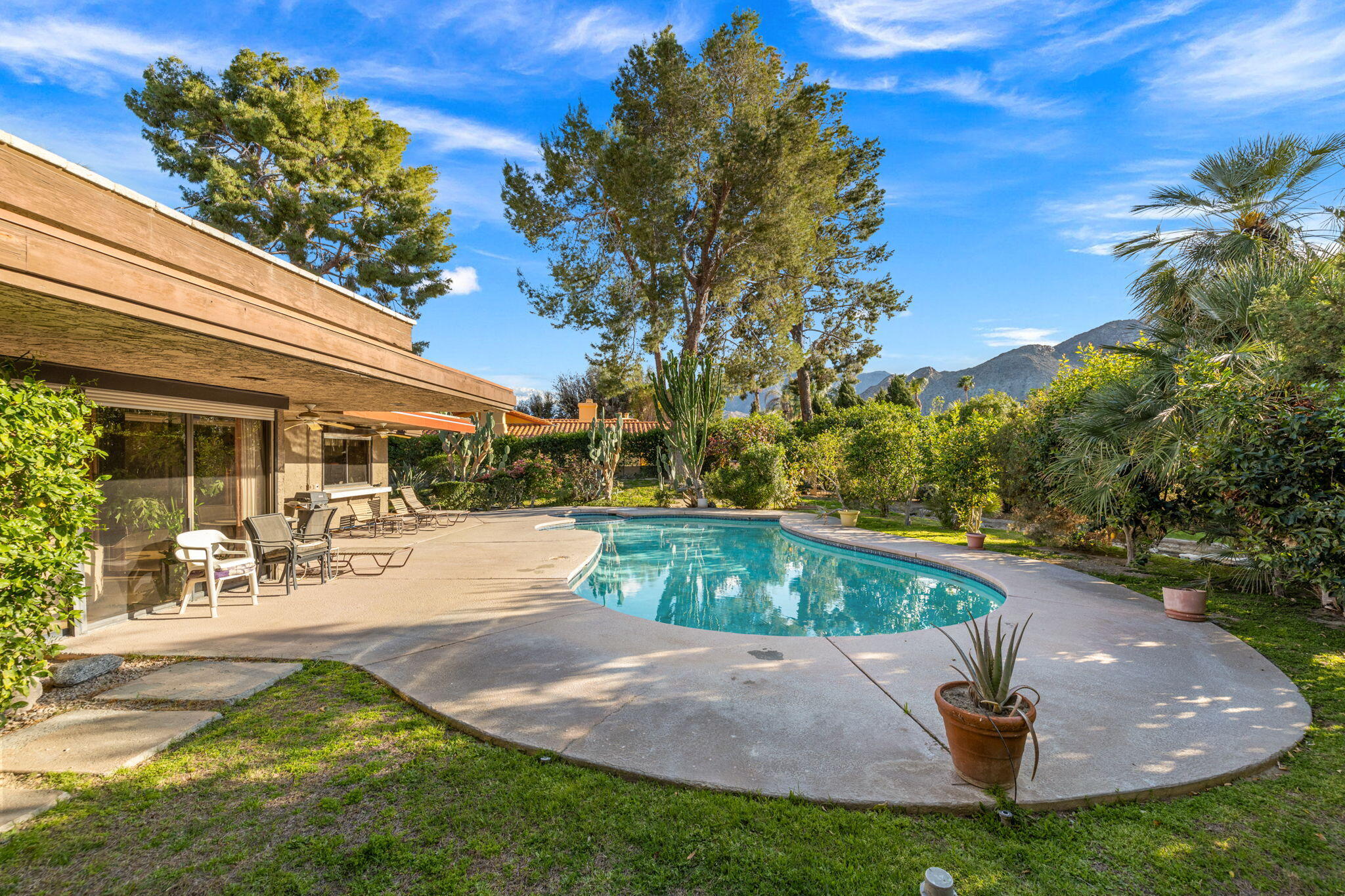 40675 East Thunderbird Terrace Rancho Mirage, CA 92270 - Photo 14 of 58 a view of a backyard with a patio