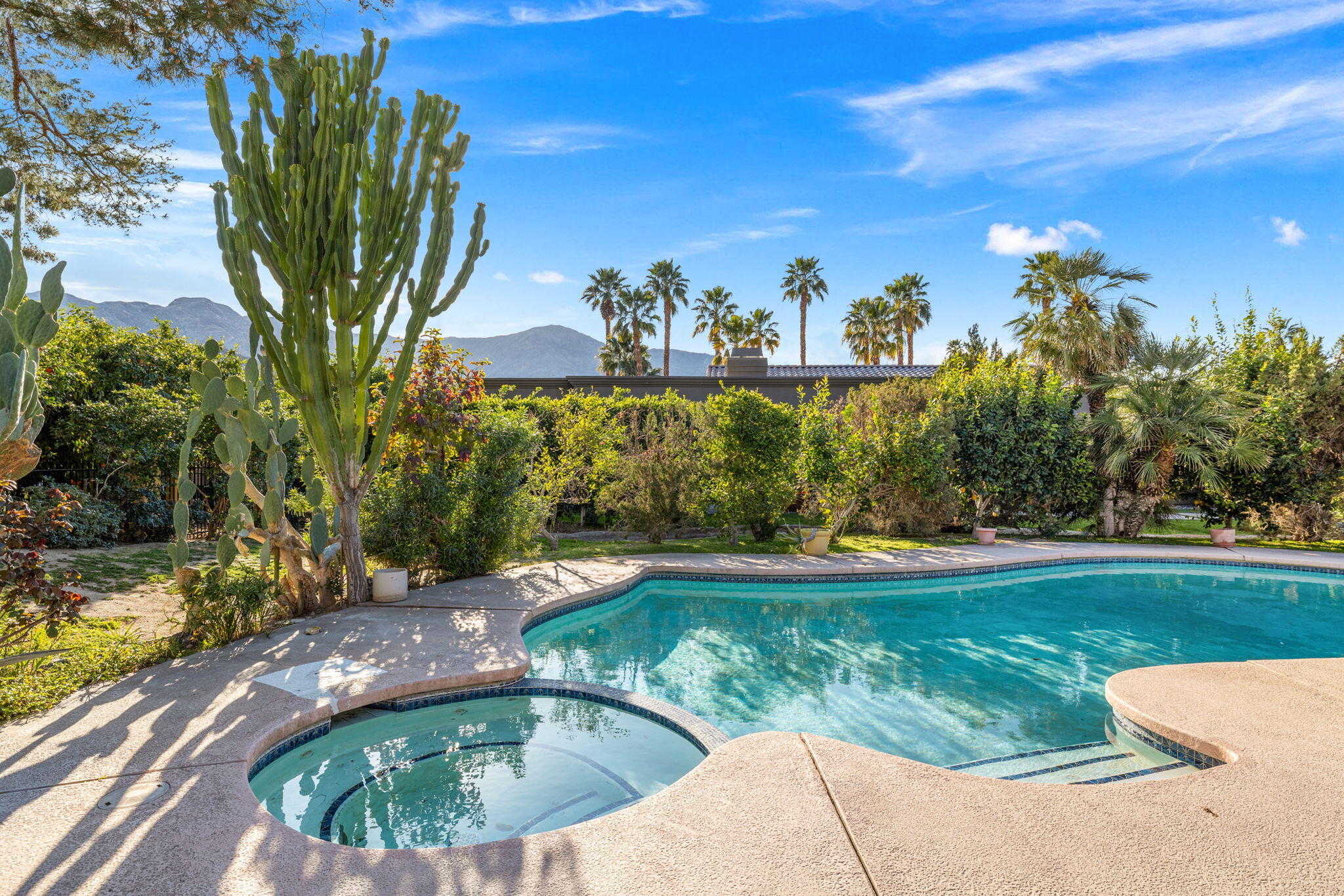 40675 East Thunderbird Terrace Rancho Mirage, CA 92270 - Photo 17 of 58 a view of a swimming pool with a yard
