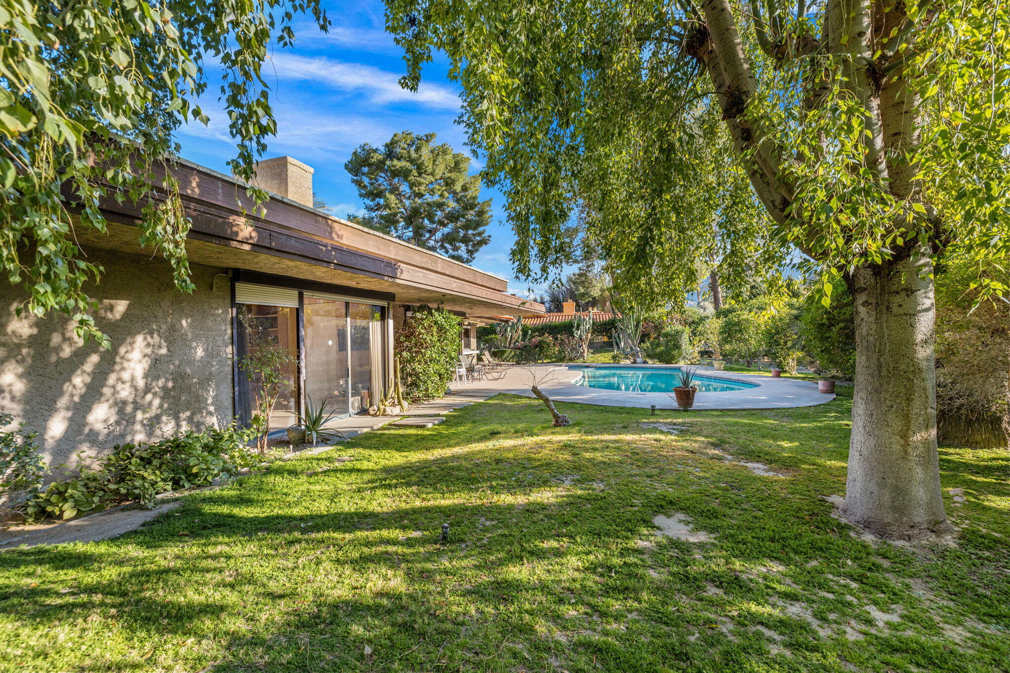 40675 East Thunderbird Terrace Rancho Mirage, CA 92270 - Photo 19 of 58 a view of a house with a yard