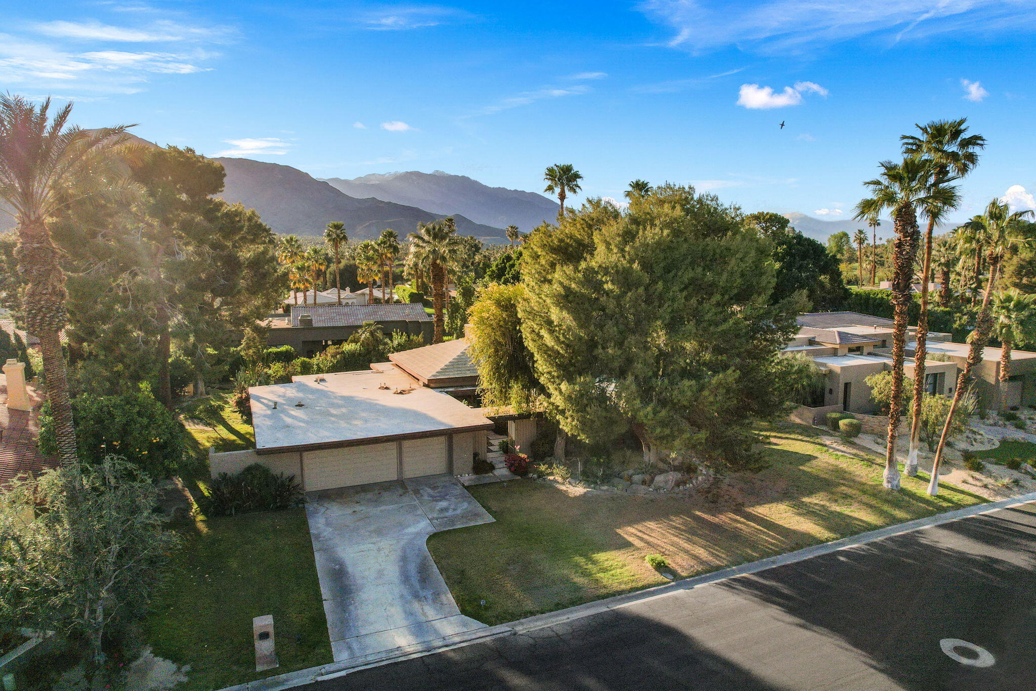 40675 East Thunderbird Terrace Rancho Mirage, CA 92270 - Photo 2 of 58 a view of a pool with a yard
