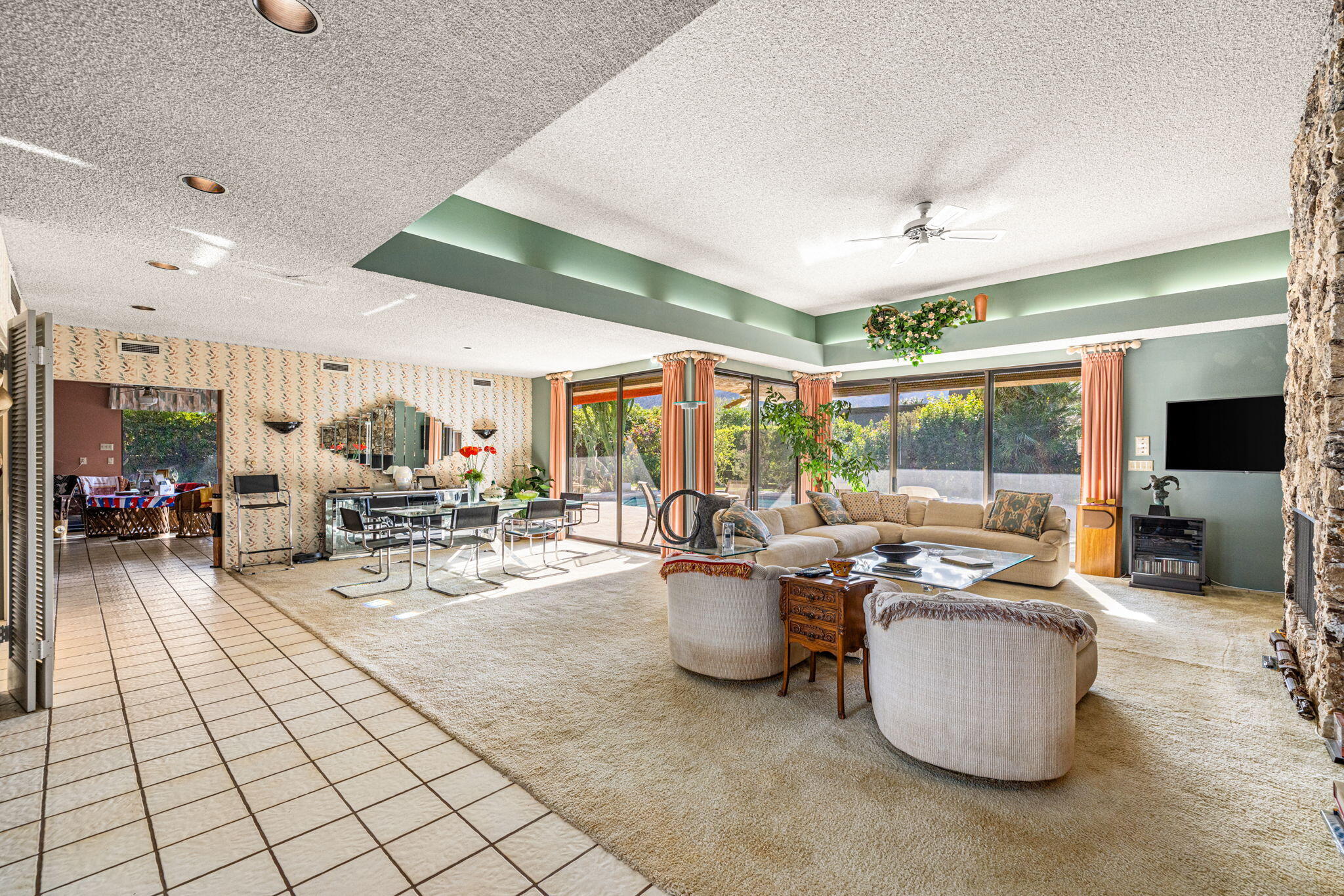 40675 East Thunderbird Terrace Rancho Mirage, CA 92270 - Photo 21 of 58 a living room with furniture and a large window