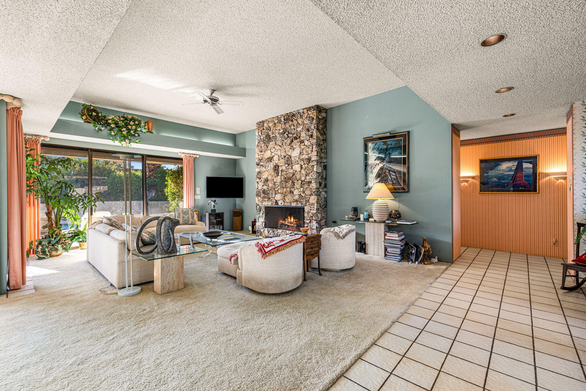 40675 East Thunderbird Terrace Rancho Mirage, CA 92270 - Photo 22 of 58 a living room with fireplace furniture and a large window
