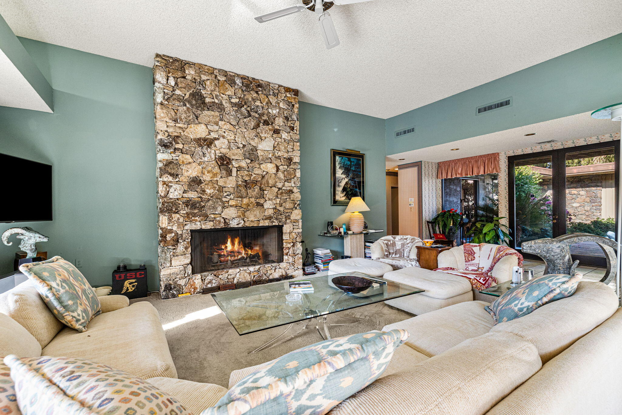 40675 East Thunderbird Terrace Rancho Mirage, CA 92270 - Photo 23 of 58 a living room with furniture and a fireplace
