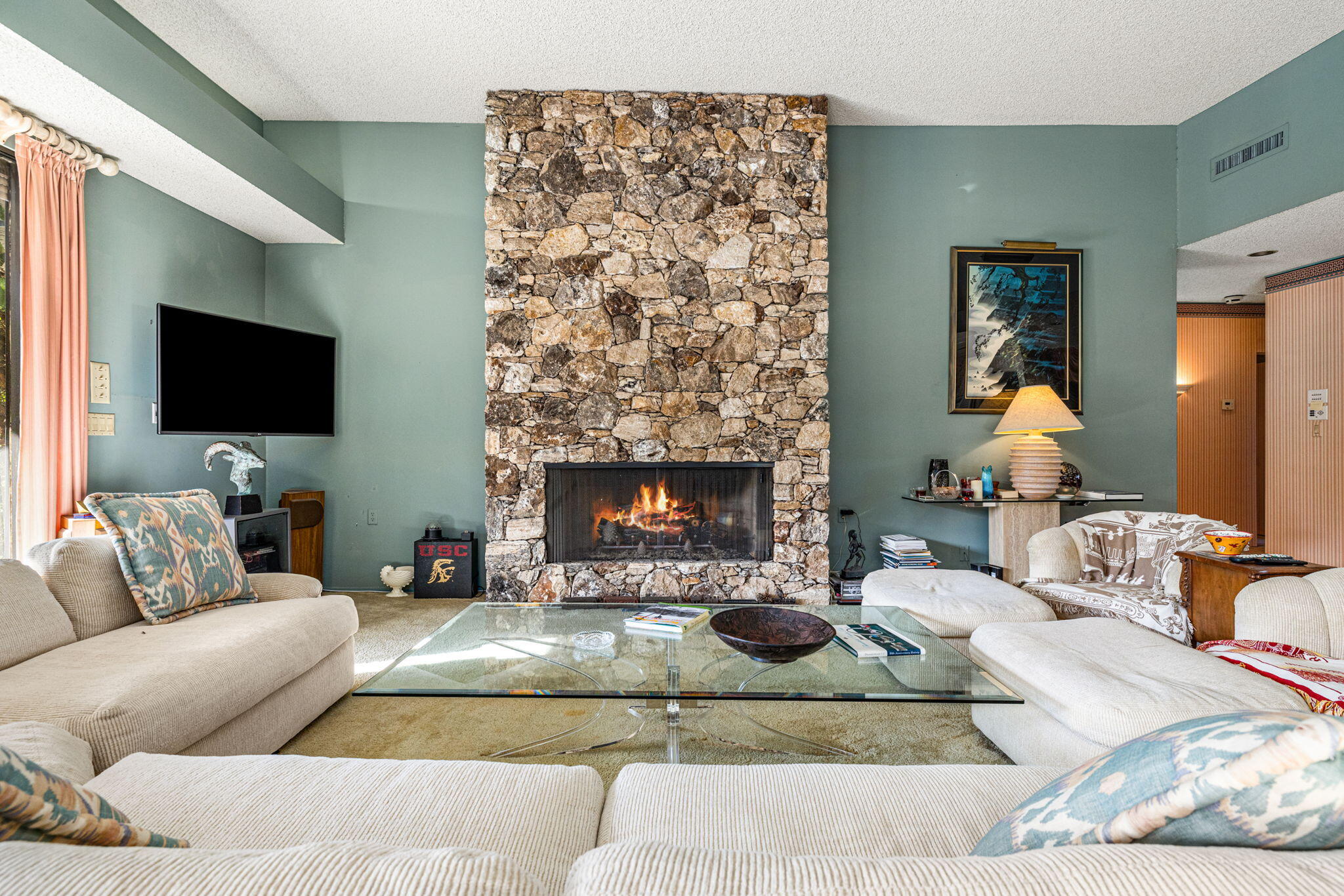 40675 East Thunderbird Terrace Rancho Mirage, CA 92270 - Photo 25 of 58 a living room with furniture and a fireplace