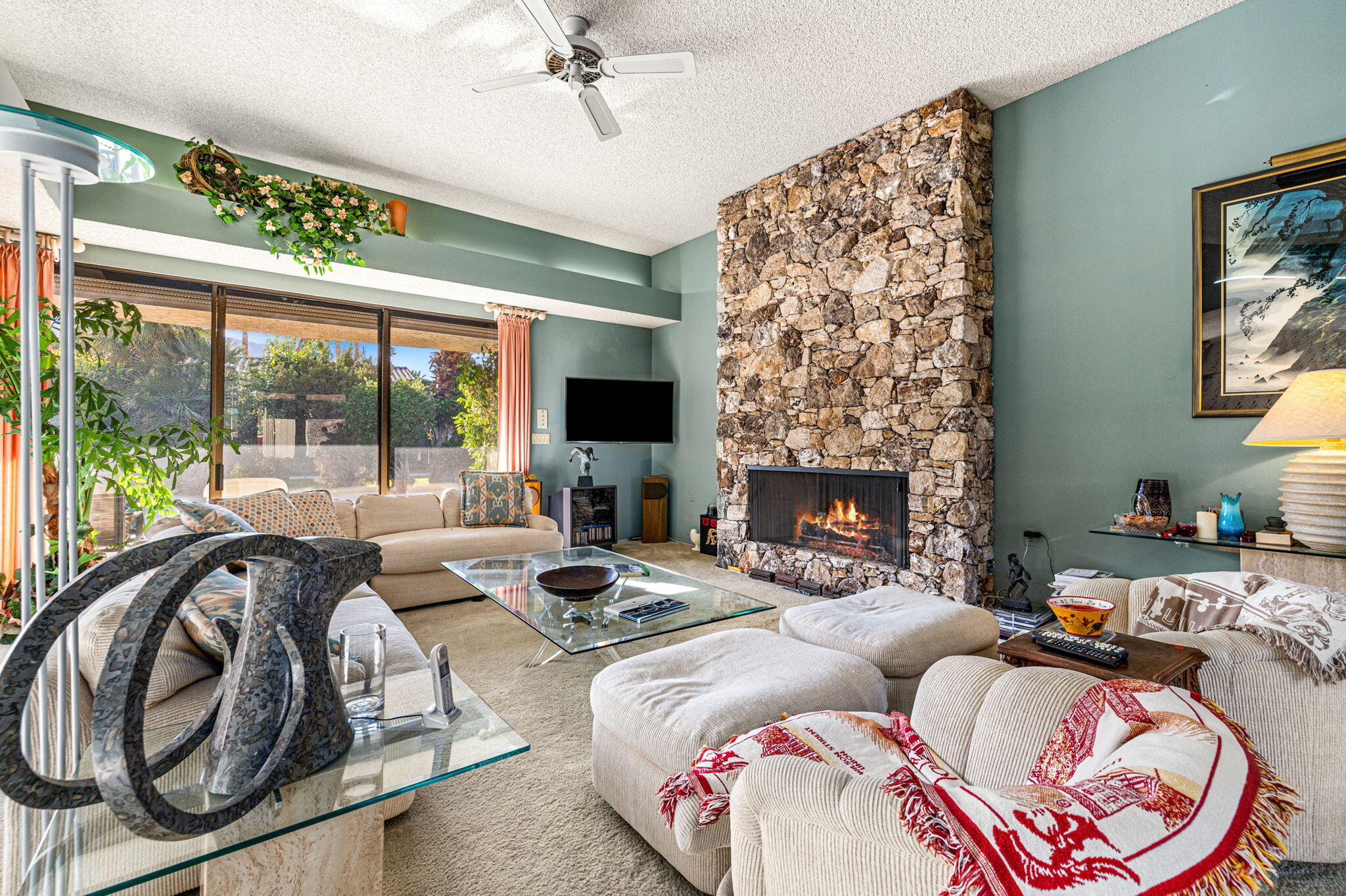 40675 East Thunderbird Terrace Rancho Mirage, CA 92270 - Photo 27 of 58 a living room with furniture and a fireplace