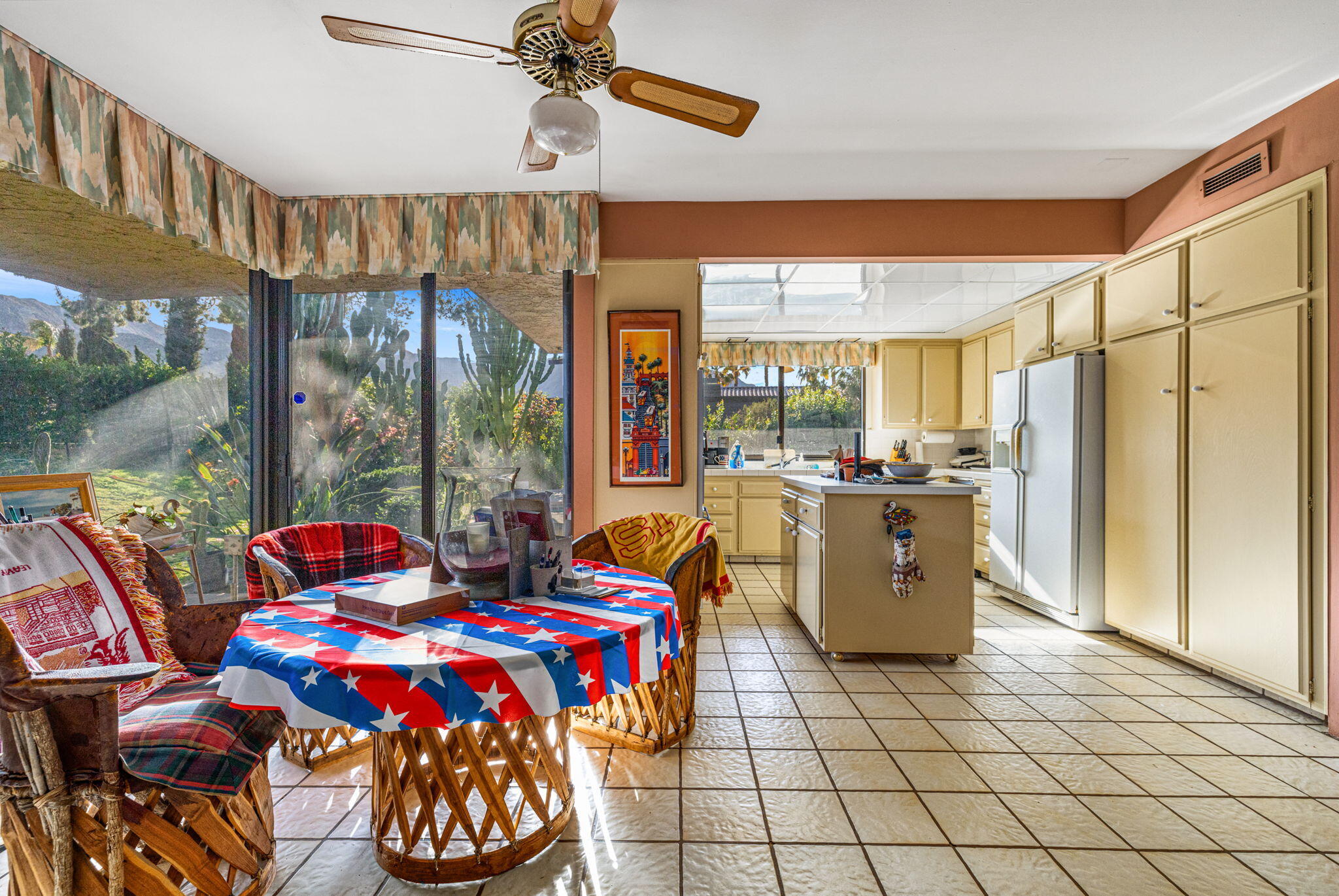 40675 East Thunderbird Terrace Rancho Mirage, CA 92270 - Photo 39 of 58 a living room with furniture a floor to ceiling window and outdoor view