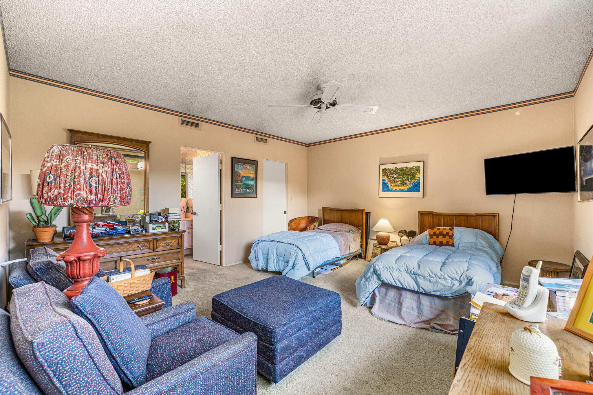 40675 East Thunderbird Terrace Rancho Mirage, CA 92270 - Photo 52 of 58 a living room with furniture and a flat screen tv
