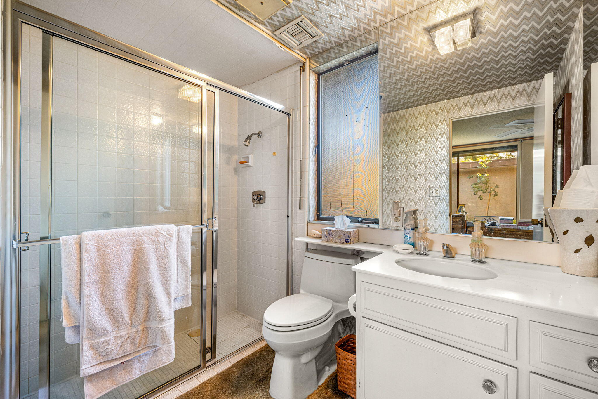 40675 East Thunderbird Terrace Rancho Mirage, CA 92270 - Photo 53 of 58 a bathroom with a toilet a sink and a mirror