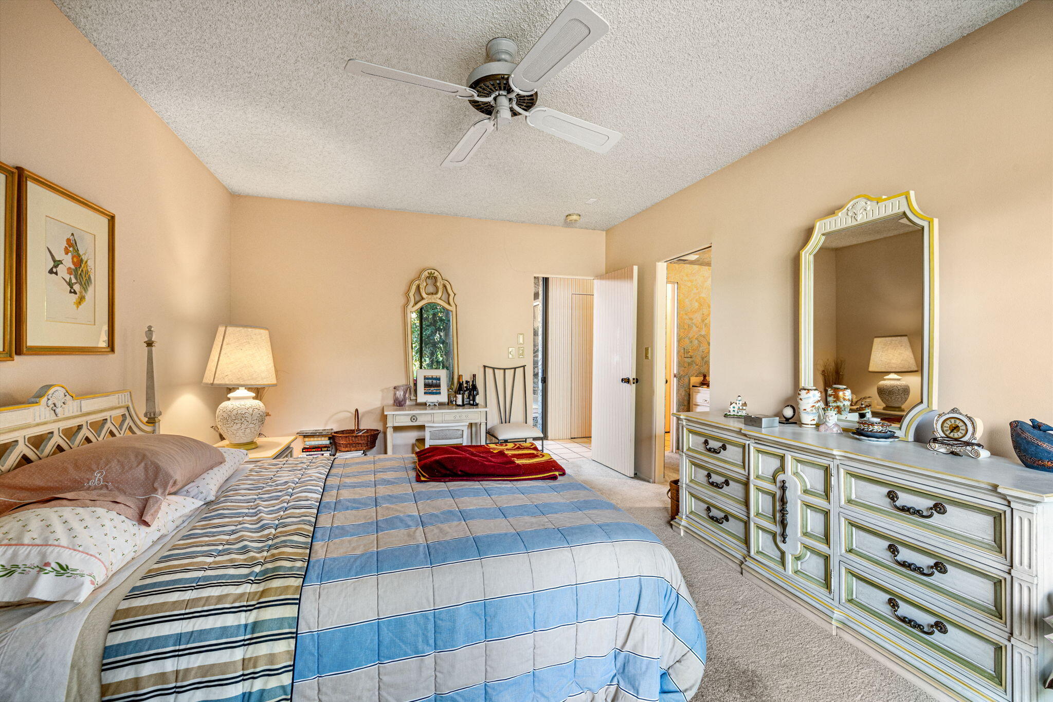 40675 East Thunderbird Terrace Rancho Mirage, CA 92270 - Photo 55 of 58 a bedroom with a bed and a chandelier