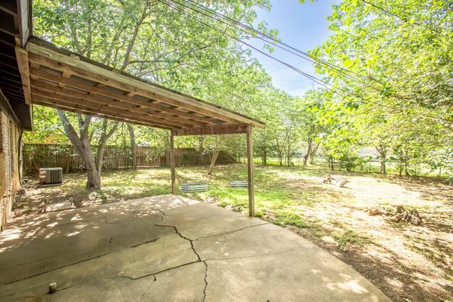 a view of a yard with an outdoor space