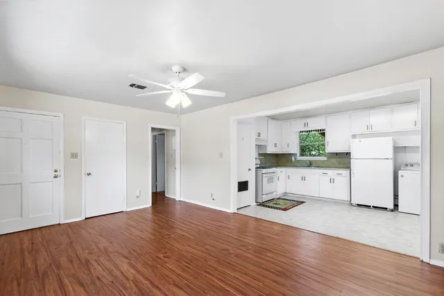 a view of a kitchen with electric appliances