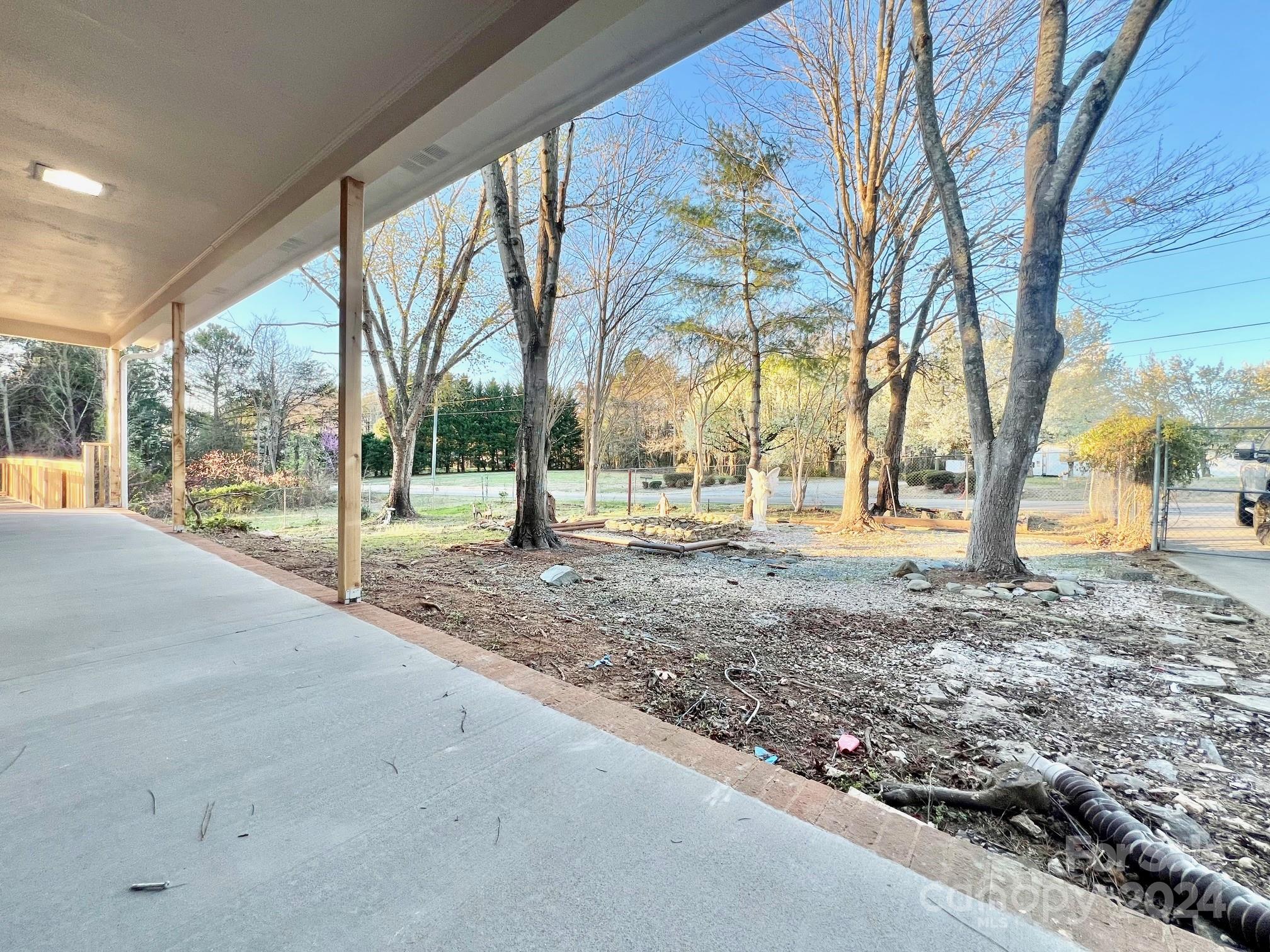 4218 Lower Cedar Valley Road Hudson, NC 28638 - Photo 3 of 27 a view of road with large trees