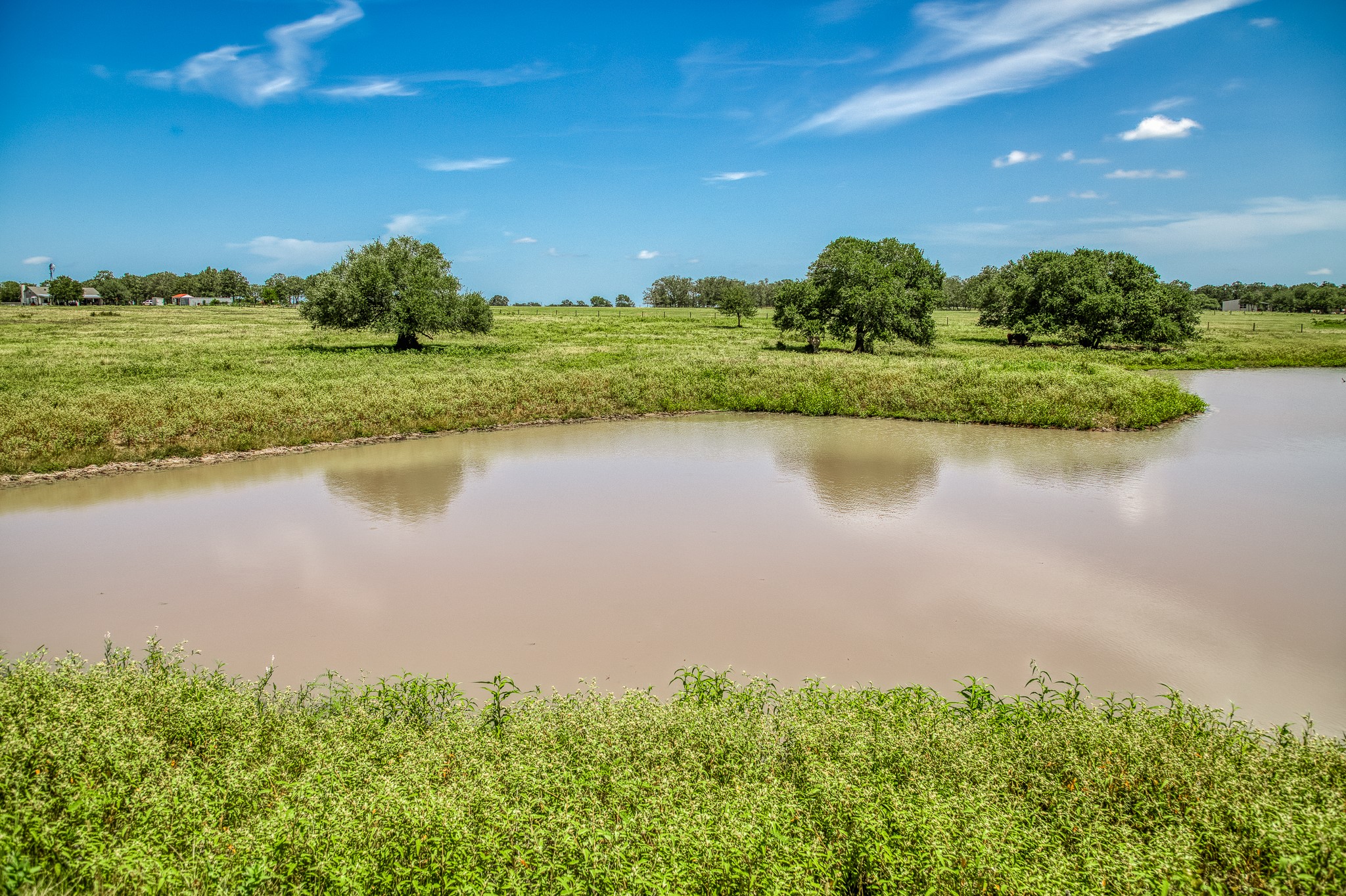a view of a lake with a big yard