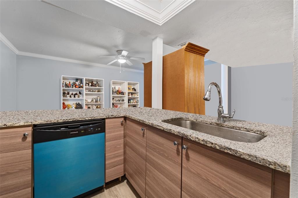 1112 Longfellow Road Sarasota, FL 34243 - Photo 14 of 48 a kitchen with granite countertop cabinets stainless steel appliances and a sink